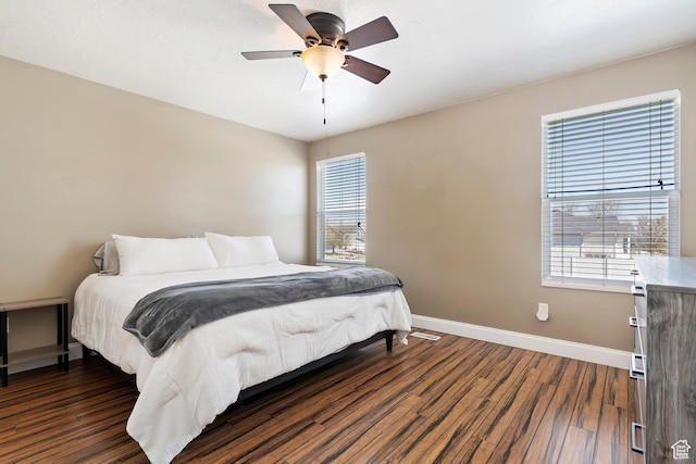 6761 S High Bluff Dr W, West Jordan, UT 84084 - bedroom featuring dark wood-style flooring, multiple windows, and baseboards