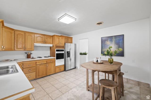 3481 S 3530 E, Salt Lake City, UT 84109 - kitchen with light tile patterned floors, visible vents, light countertops, white appliances, and a warming drawer