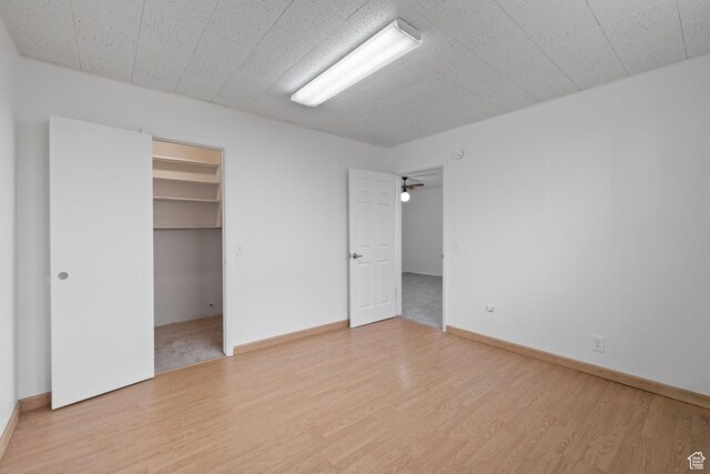 3481 S 3530 E, Salt Lake City, UT 84109 - unfurnished bedroom with wood finished floors, baseboards, and a spacious closet