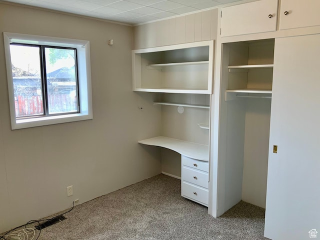 165 W 500 N, Richfield, UT 84701 - unfurnished bedroom featuring light colored carpet, crown molding, and a closet