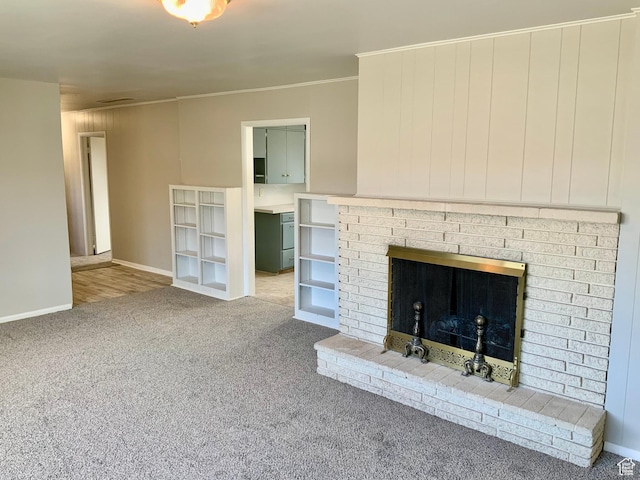 165 W 500 N, Richfield, UT 84701 - unfurnished living room with carpet flooring, baseboards, crown molding, and a brick fireplace