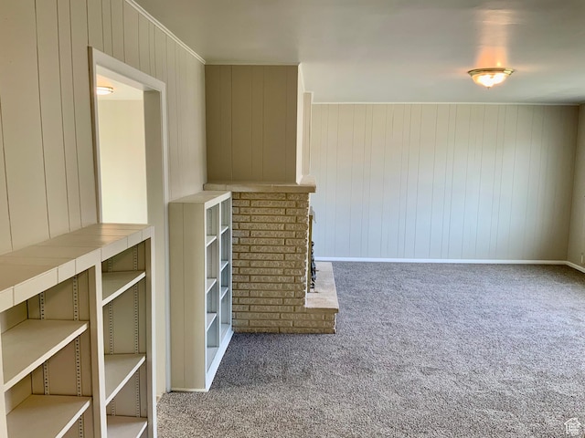 165 W 500 N, Richfield, UT 84701 - unfurnished living room featuring carpet floors, wooden walls, and baseboards