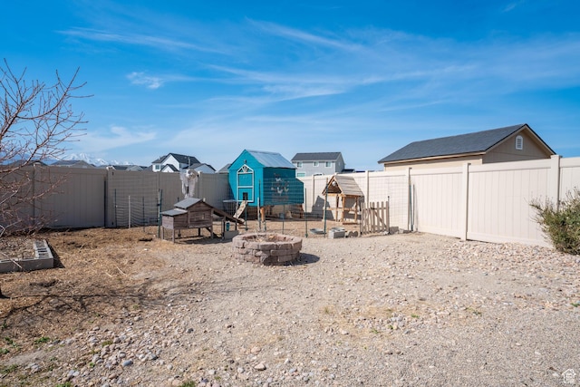 4687 E Jordan Way, Eagle Mountain, UT 84005 - view of yard with exterior structure, a fenced backyard, and an outbuilding