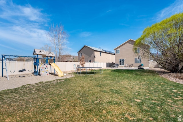 4687 E Jordan Way, Eagle Mountain, UT 84005 - view of yard with a patio area, a fenced backyard, a trampoline, and a playground