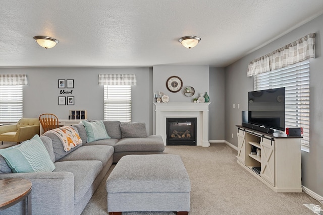 4687 E Jordan Way, Eagle Mountain, UT 84005 - living room with baseboards, light colored carpet, a glass covered fireplace, and a textured ceiling