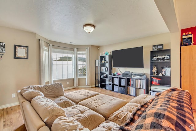 1021 E Riverbend Ln S, Ogden, UT 84404 - living room with baseboards, a textured ceiling, and wood finished floors