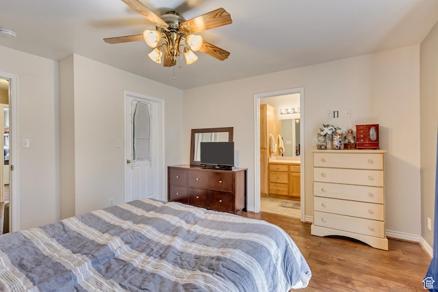 1021 E Riverbend Ln S, Ogden, UT 84404 - bedroom featuring baseboards, a ceiling fan, ensuite bath, and wood finished floors
