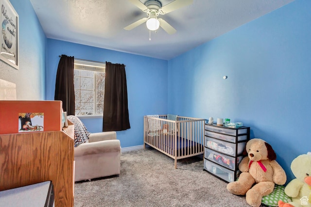 1021 E Riverbend Ln S, Ogden, UT 84404 - bedroom with a nursery area, baseboards, a ceiling fan, and carpet floors