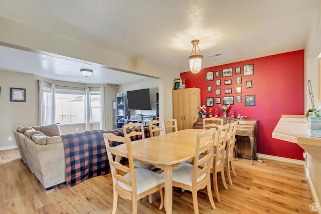 1021 E Riverbend Ln S, Ogden, UT 84404 - dining room with visible vents, baseboards, and light wood-type flooring