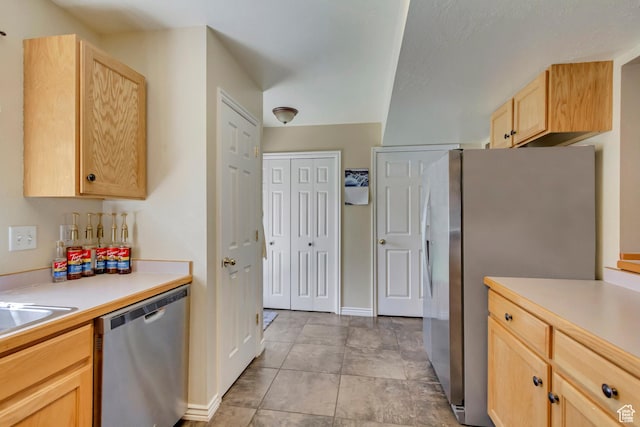 1021 E Riverbend Ln S, Ogden, UT 84404 - kitchen featuring light countertops, appliances with stainless steel finishes, light brown cabinets, and baseboards