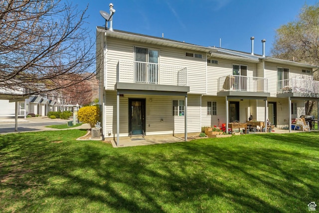 1021 E Riverbend Ln S, Ogden, UT 84404 - back of house with central air condition unit, a patio, a yard, and a balcony