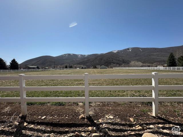 property view of mountains featuring a rural view