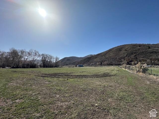 property view of mountains featuring a rural view