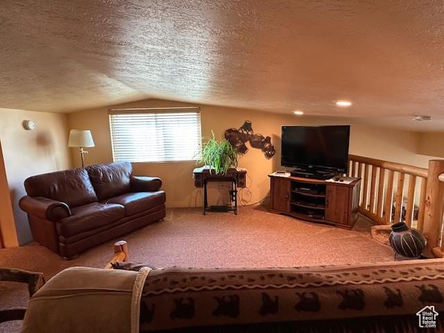 living area featuring carpet floors, lofted ceiling, and a textured ceiling
