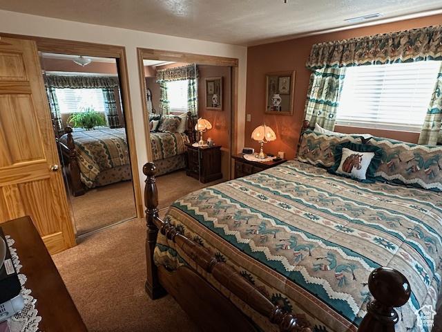 bedroom with light carpet