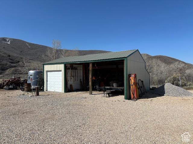 detached garage with a mountain view