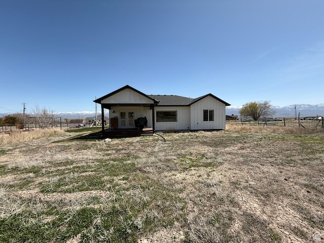 140 S 100 E, Wales, UT 84667 - view of front facade with a rural view, french doors, board and batten siding, and fence