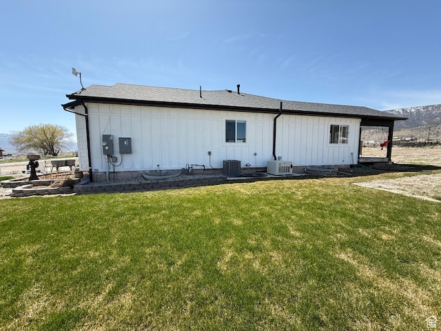 140 S 100 E, Wales, UT 84667 - rear view of house with a yard, cooling unit, and board and batten siding