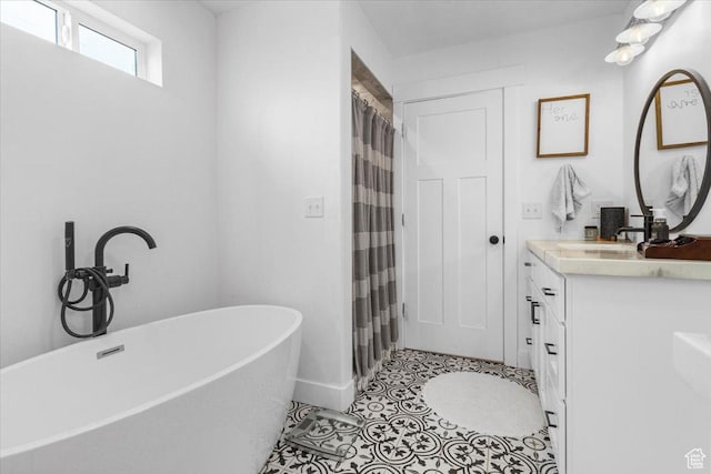 140 S 100 E, Wales, UT 84667 - full bathroom featuring vanity, baseboards, curtained shower, a soaking tub, and tile patterned flooring