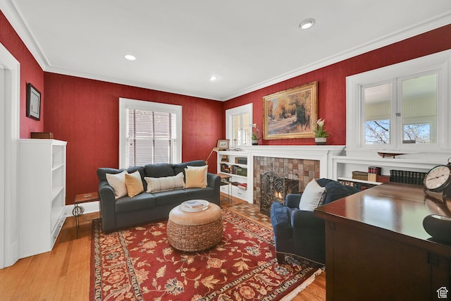 1401 E Sigsbee Ave, Salt Lake City, UT 84103 - living room with recessed lighting, a tile fireplace, light wood-style flooring, and crown molding
