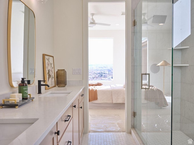 full bathroom featuring a sink, ceiling fan, double vanity, ensuite bath, and a stall shower