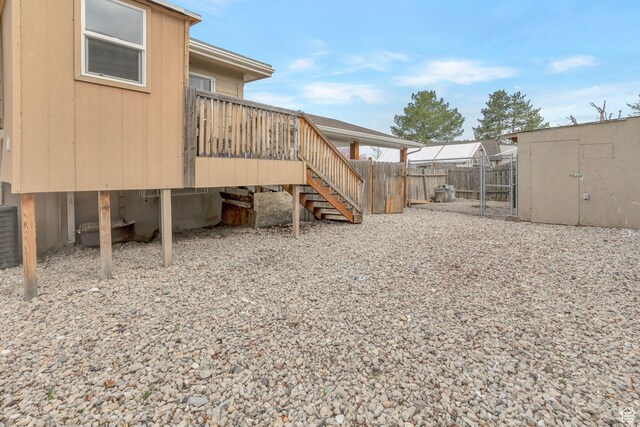 6828 S Georgia Dr, West Jordan, UT 84084 - view of yard with a shed, stairs, an outdoor structure, and fence