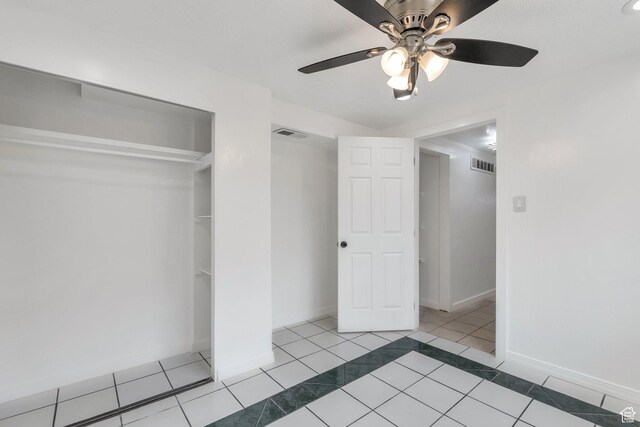 6828 S Georgia Dr, West Jordan, UT 84084 - unfurnished bedroom featuring tile patterned flooring, visible vents, a closet, and baseboards