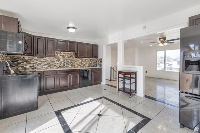 6828 S Georgia Dr, West Jordan, UT 84084 - kitchen featuring dark brown cabinets, black appliances, light countertops, a sink, and decorative backsplash