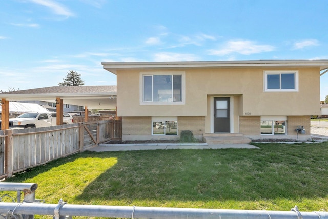 6828 S Georgia Dr, West Jordan, UT 84084 - back of house with a yard, stucco siding, fence, and brick siding