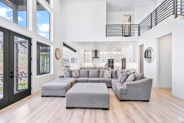 94 S 950 E, Hyde Park, UT 84318 - living area featuring french doors, a high ceiling, and a healthy amount of sunlight