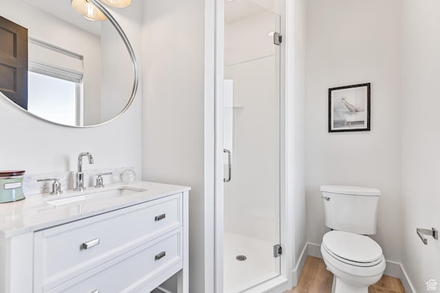 94 S 950 E, Hyde Park, UT 84318 - full bathroom featuring a shower stall, wood finished floors, vanity, and toilet
