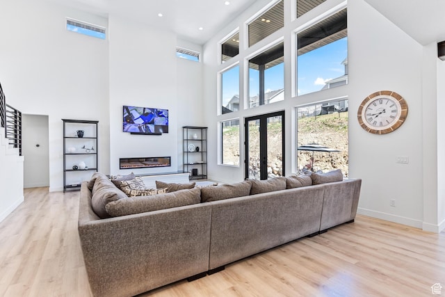 94 S 950 E, Hyde Park, UT 84318 - living area with baseboards, recessed lighting, a high ceiling, and wood finished floors