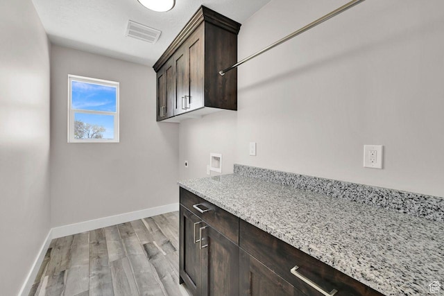 3005 W 3300 S, West Haven, UT 84401 - laundry area featuring hookup for an electric dryer, light wood-style flooring, washer hookup, visible vents, and cabinet space