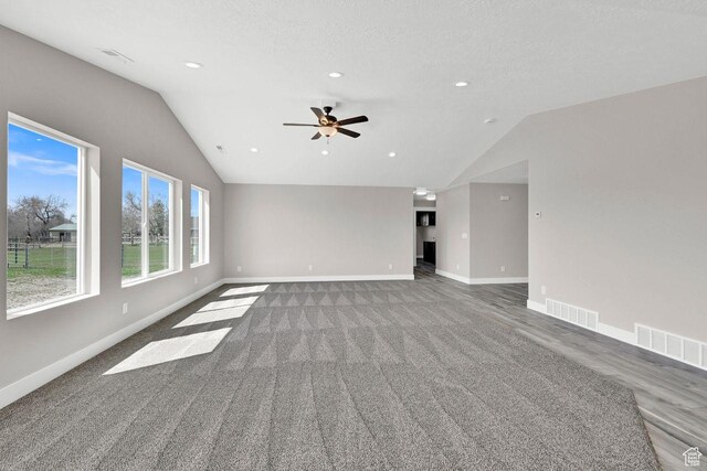 3005 W 3300 S, West Haven, UT 84401 - unfurnished living room with visible vents, baseboards, and lofted ceiling