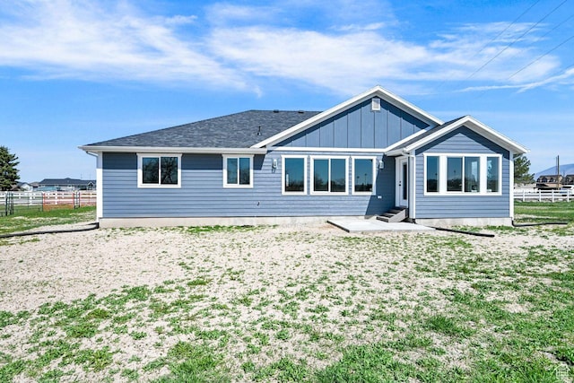 3005 W 3300 S, West Haven, UT 84401 - back of property featuring entry steps, board and batten siding, and fence