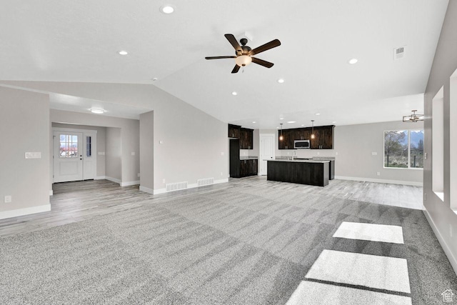 3005 W 3300 S, West Haven, UT 84401 - unfurnished living room featuring a wealth of natural light, visible vents, and vaulted ceiling