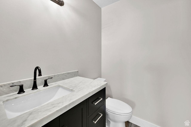 3005 W 3300 S, West Haven, UT 84401 - bathroom featuring toilet, vanity, and baseboards