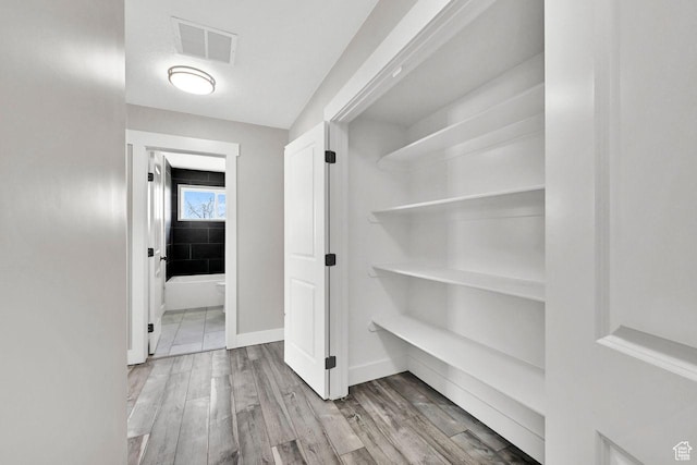 3005 W 3300 S, West Haven, UT 84401 - hallway with visible vents, baseboards, and wood finished floors