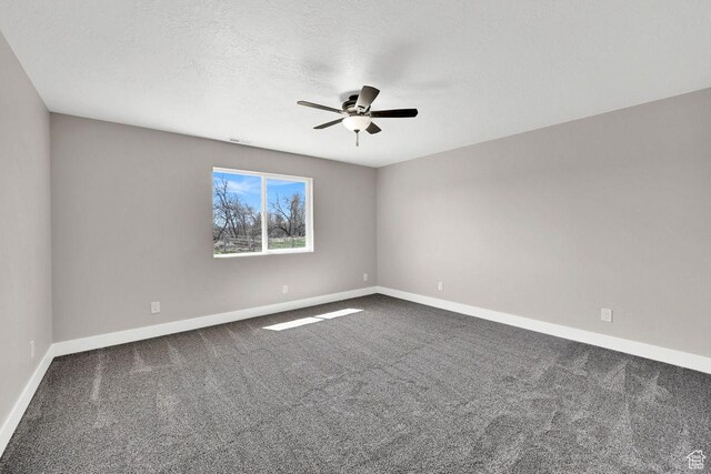 3005 W 3300 S, West Haven, UT 84401 - spare room with dark colored carpet, a ceiling fan, and baseboards