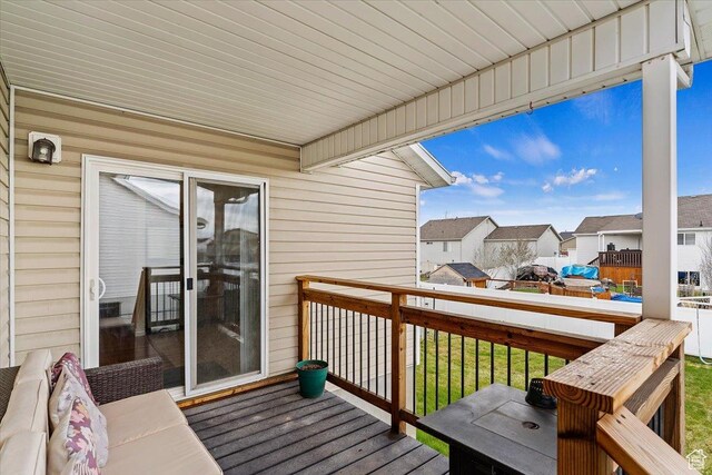 wooden deck with a residential view