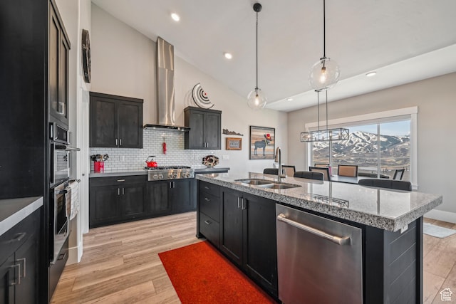 11285 N Shoreline Ct, Hideout, UT 84036 - kitchen featuring tasteful backsplash, wall chimney exhaust hood, a sink, appliances with stainless steel finishes, and dark cabinets