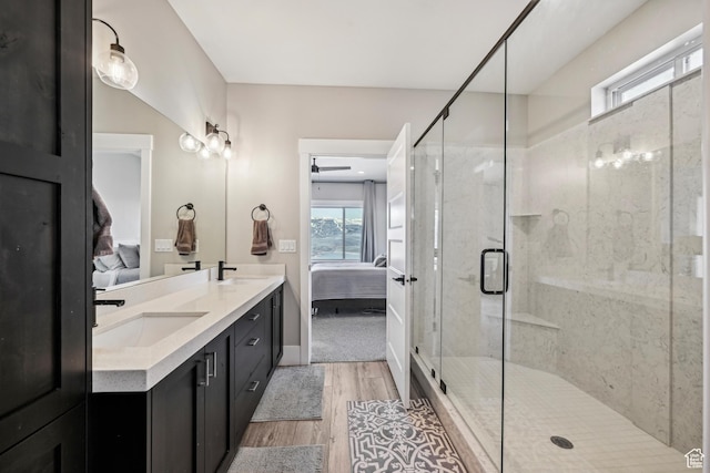 11285 N Shoreline Ct, Hideout, UT 84036 - bathroom featuring a stall shower, wood finished floors, a sink, and ensuite bath
