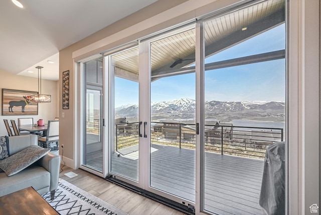 11285 N Shoreline Ct, Hideout, UT 84036 - doorway to outside featuring recessed lighting, light wood-style flooring, baseboards, and a mountain view