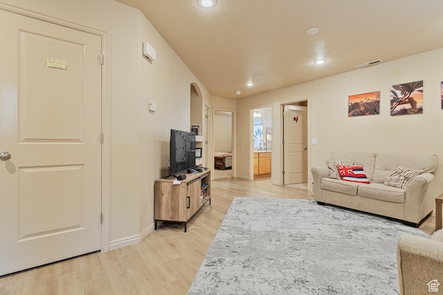 2930 E 450 N Unit F6, St George, UT 84790 - living room featuring recessed lighting, visible vents, arched walkways, light wood-style floors, and baseboards