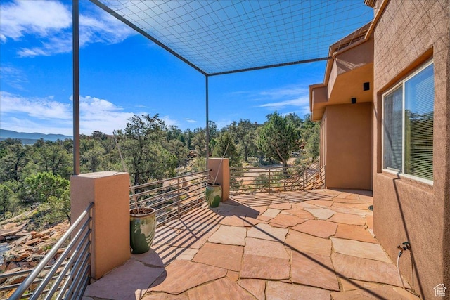 view of patio with a balcony