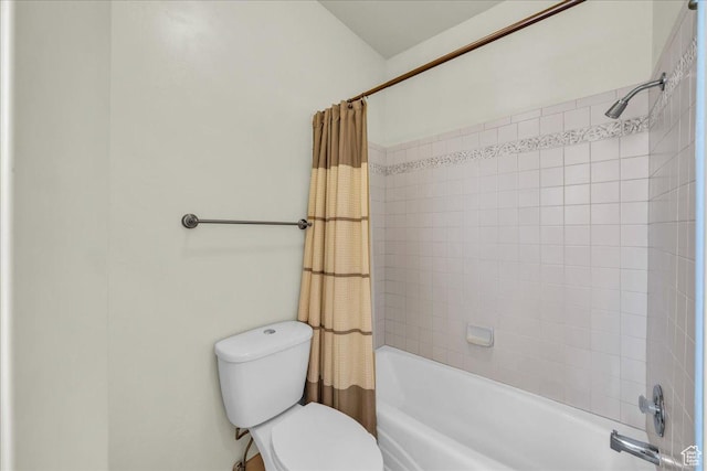bathroom featuring toilet and shower / bathtub combination with curtain