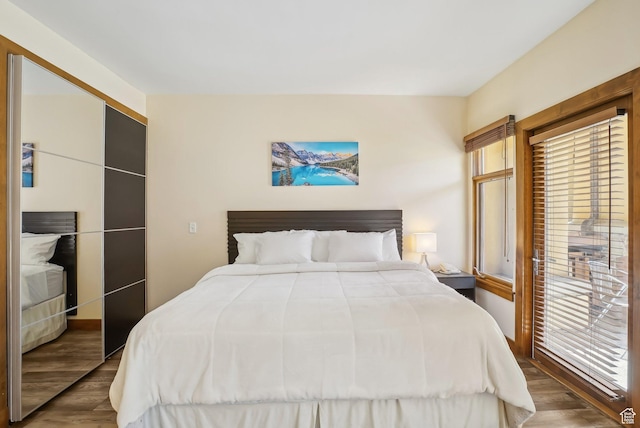 3720 N Sundial Ct Unit Cg02, Park City, UT 84098 - bedroom with multiple windows and wood finished floors