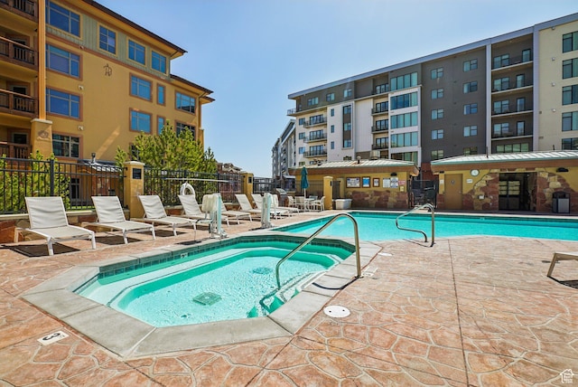 3720 N Sundial Ct Unit Cg02, Park City, UT 84098 - pool with a patio area, a community hot tub, and fence