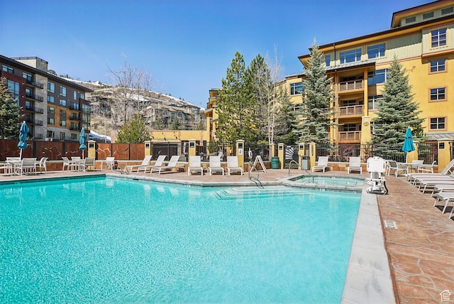 3720 N Sundial Ct Unit Cg02, Park City, UT 84098 - pool with a patio, a community hot tub, and fence