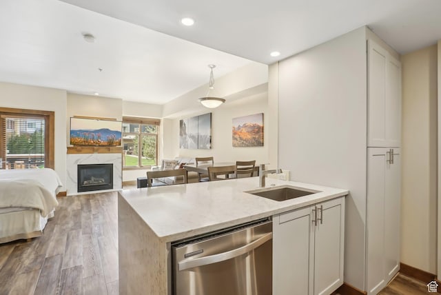 3720 N Sundial Ct Unit Cg02, Park City, UT 84098 - kitchen with a sink, stainless steel dishwasher, a wealth of natural light, and light stone counters